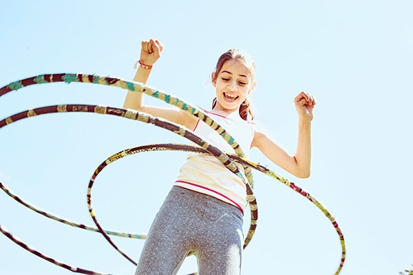camper doing hula hoop